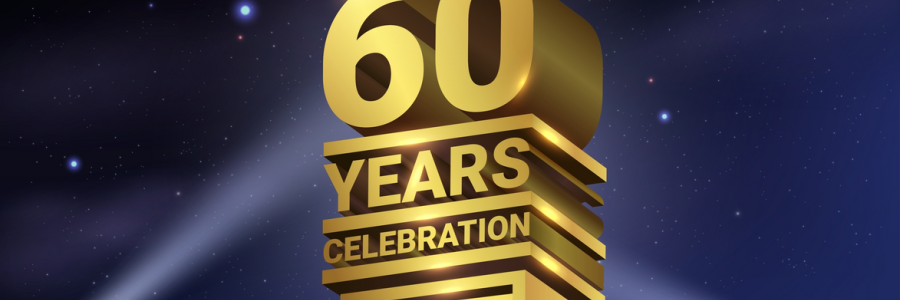 Image shows a 3D gold statue with the words 60 years celebration lit with spotlights from below.